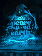 Custom engraved Peace on Earth bauble illuminated with multi-colour LED lights