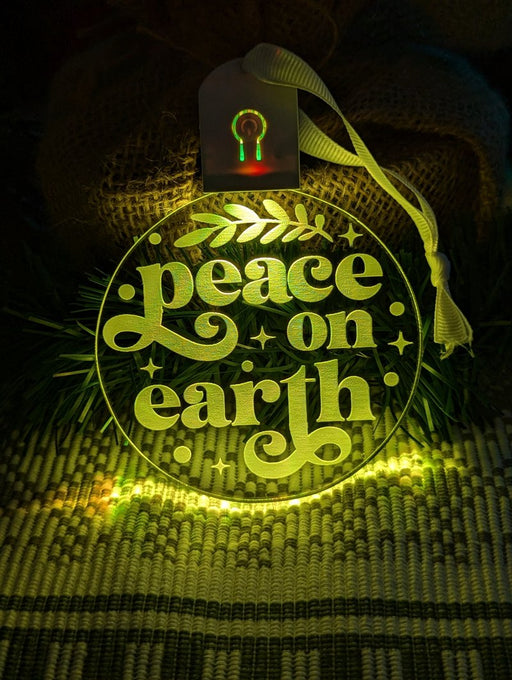  Peace on Earth LED acrylic light bauble with 7-colour glow and engraved design
