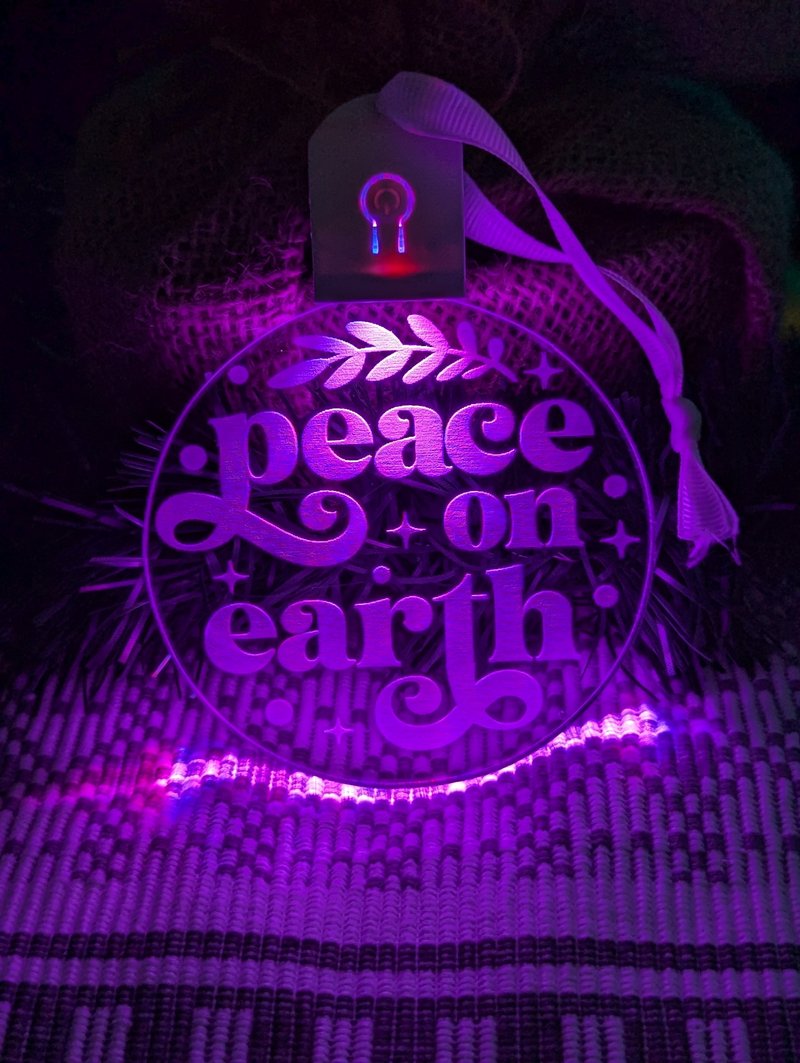 Vibrant 7-colour Peace on Earth acrylic bauble with on/off button and engraving