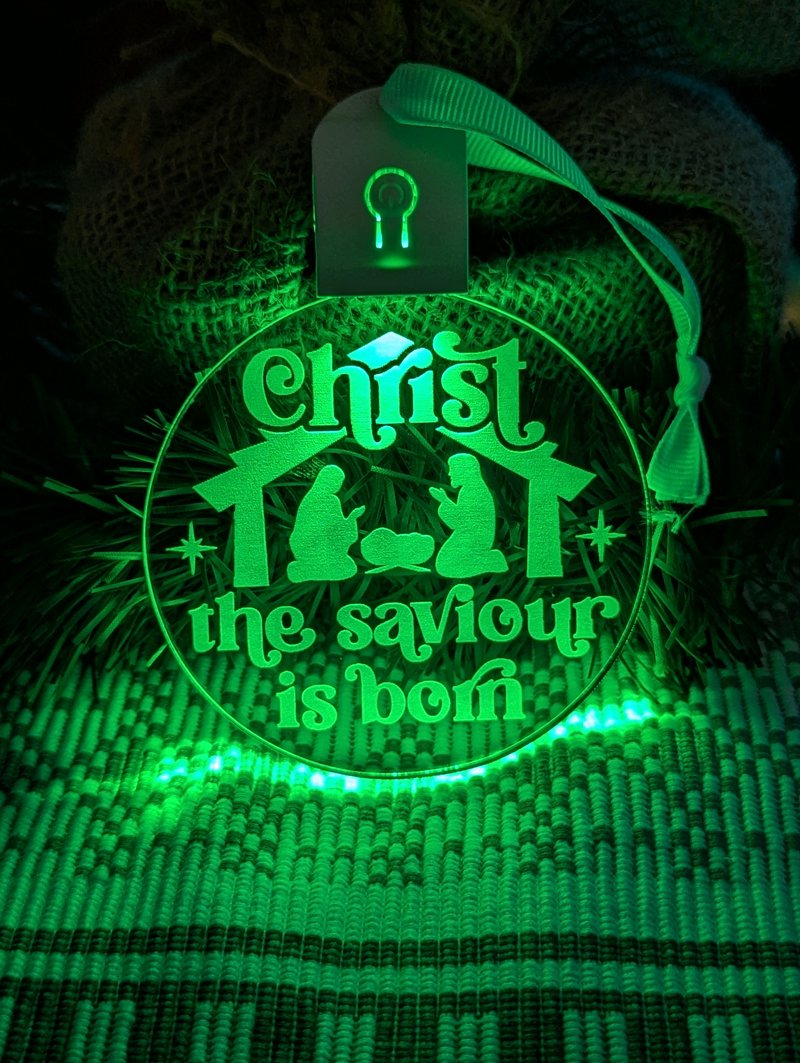 Vibrant 7-colour Christ the Saviour is Born acrylic bauble with on/off button and engraving