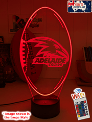 Adelaide Crows 3D LED night light glowing softly in a child’s bedroom with remote control.