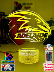 Adelaide Crows3D LED night light glowing softly in a child’s bedroom with remote control. white crackle-base