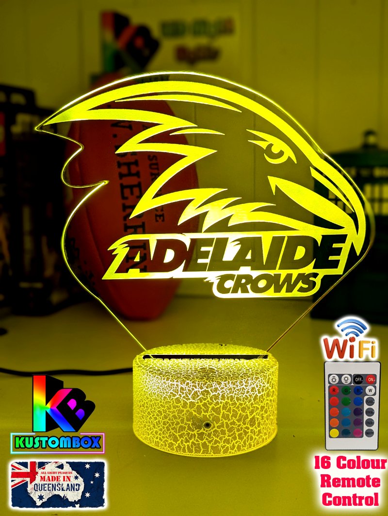 Adelaide Crows3D LED night light glowing softly in a child’s bedroom with remote control. white crackle-base