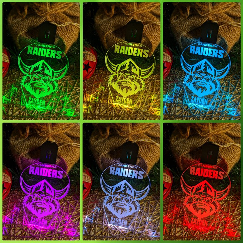 Personalised Canberra Raiders LED acrylic bauble glowing in multiple colours with team logo