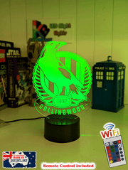 Collingwood Magpies 3D LED night light glowing softly in a child’s bedroom with remote control.