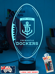 Fremantle dockers 3D LED night light glowing softly in a child’s bedroom with remote control.