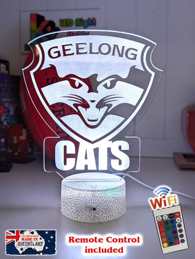 Geelong Cats 3D LED night light glowing softly in a child’s bedroom with remote control.