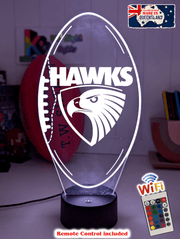 Hawthorn Hawks ball shaped 3D LED night light glowing softly in a child’s bedroom with remote control.