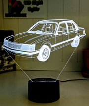 Holden VH Commodore SL/E logo 3D LED night light engraved on clear acrylic with vibrant multi-colour glow, ideal for man caves and garages