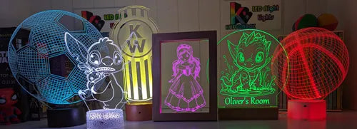 Colorful 3D light-up signs with various designs on a shelf.