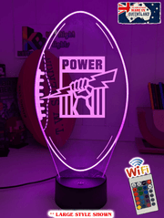 Port Adelaide Power 3D LED night light glowing softly in a child’s bedroom with remote control