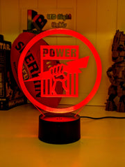 Port Adelaide Power old logo 3D LED night light glowing softly in a child’s bedroom with remote control.
