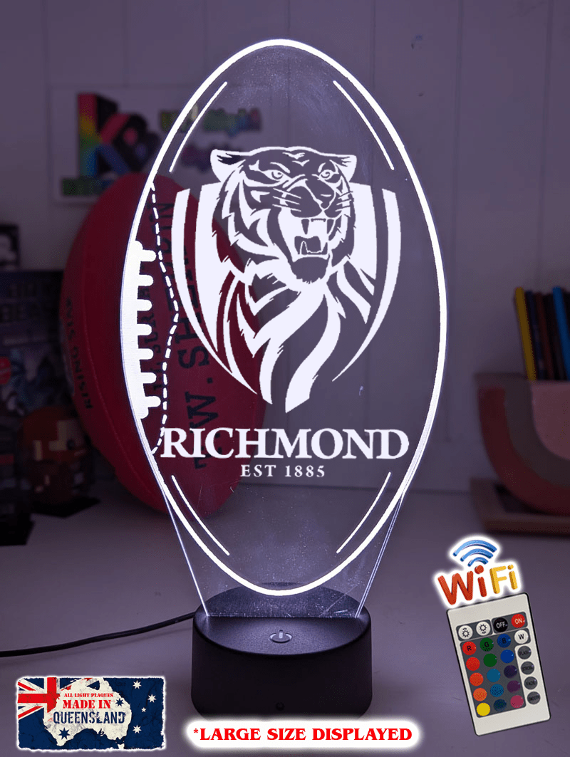 Richmond Tigers 3D LED night light glowing softly in a child’s bedroom with remote control.