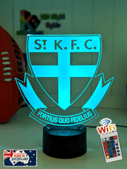 St Kilda Saints old logo 3D LED night light glowing softly in a child’s bedroom with remote control.