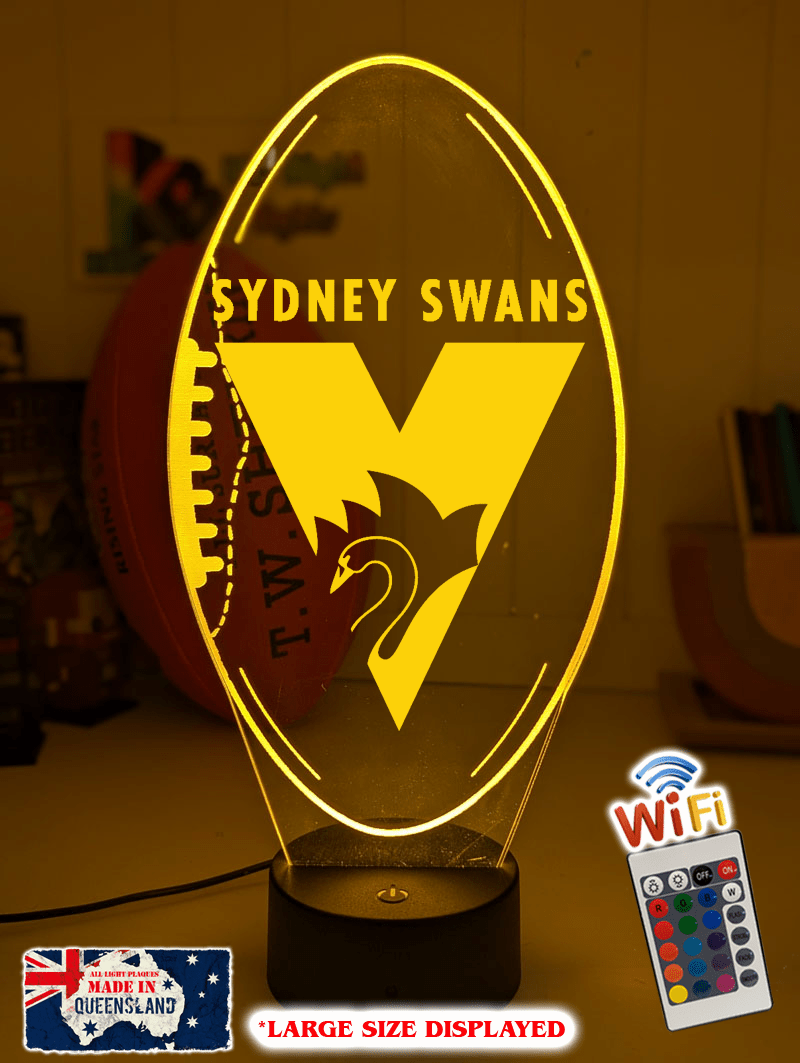 Sydney Swans 3D LED night light glowing softly in a child’s bedroom with remote control.
